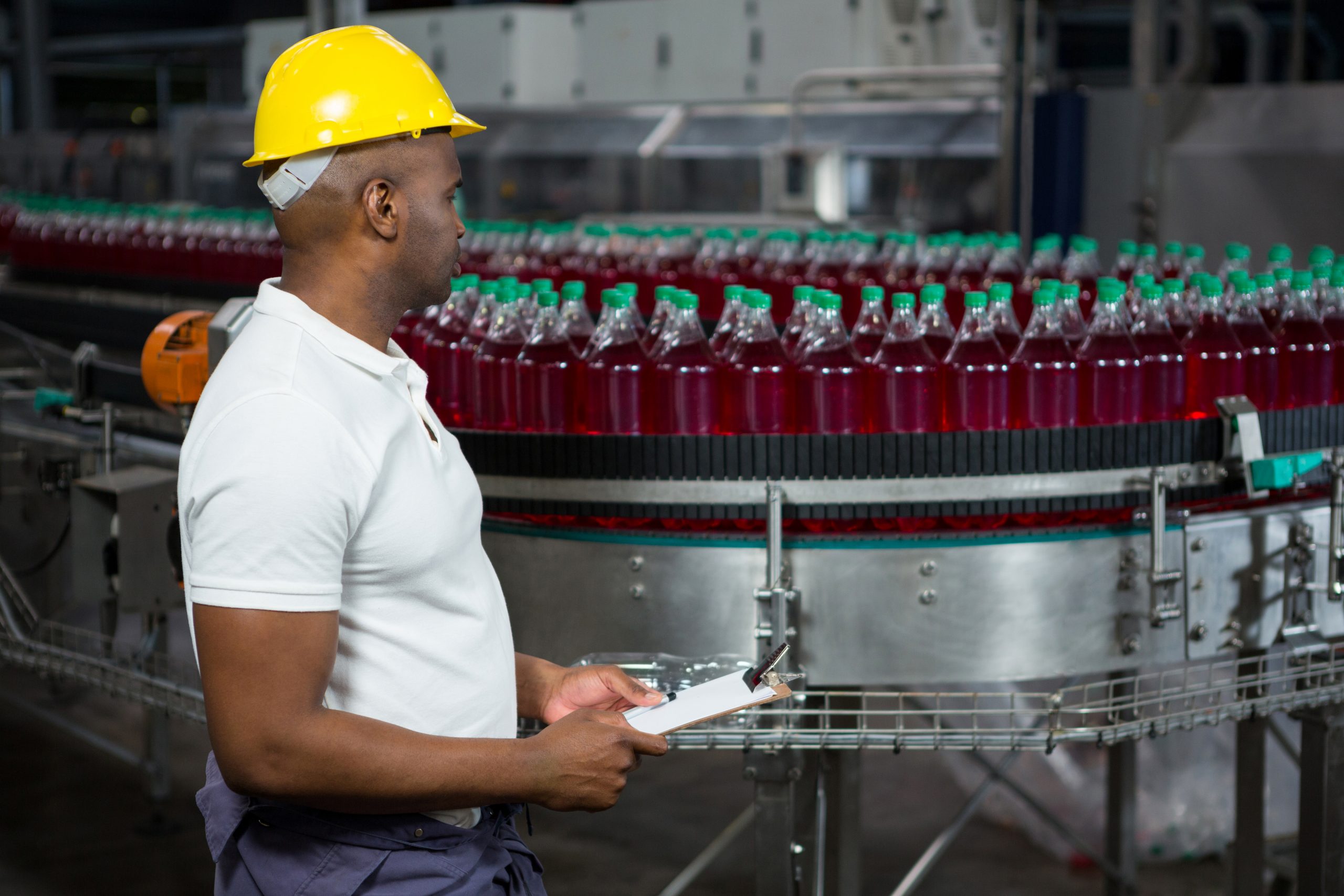 male worker with packaging automation machinery