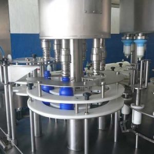Rotary bottle filling machines