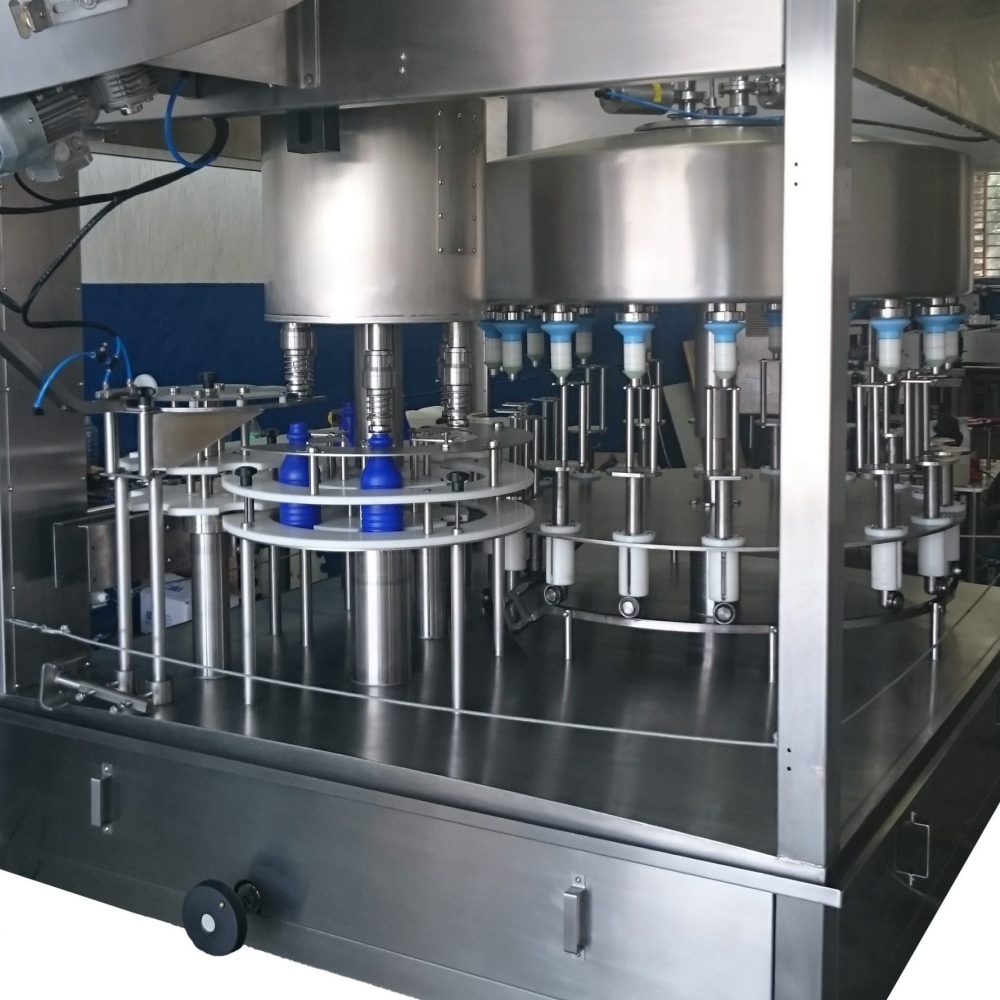 Liquid Filling Machines: Rotary Gravity Level Filling - Tigre Solutions
