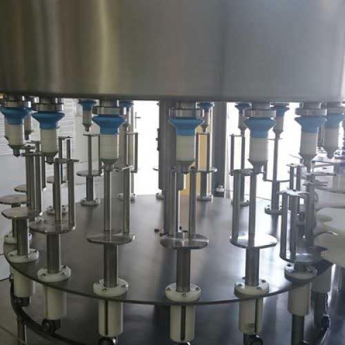 Rotary gravity system, liquid filling, consistent volume, production efficiency